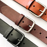 Four different colors of Rogue Industries' Chamberlain Belt and Minimalist Wallet Bundle on a white surface.