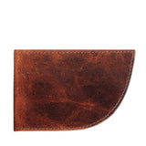 A Factory Second PREVIOUSLY EMBOSSED Made in Maine Front Pocket Wallet by Rogue Industries, crafted from brown leather with a slim design and partially rounded edges, viewed from the side.