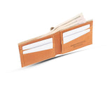A Heritage Wallet in Baseball Glove Leather by Rogue Industries with money in it, made in the USA.