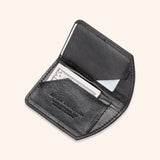 A Rogue Industries Chamberlain Belt and Minimalist Wallet Bundle with a credit card inside.
