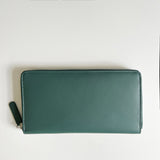 A green, premium leather Rogue Industries Leather Smartphone Clutch on a white surface.
